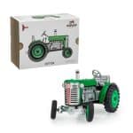 Tracteur à remonter Zetor vert devant sa boîte de biais gauche, marque Kovap.